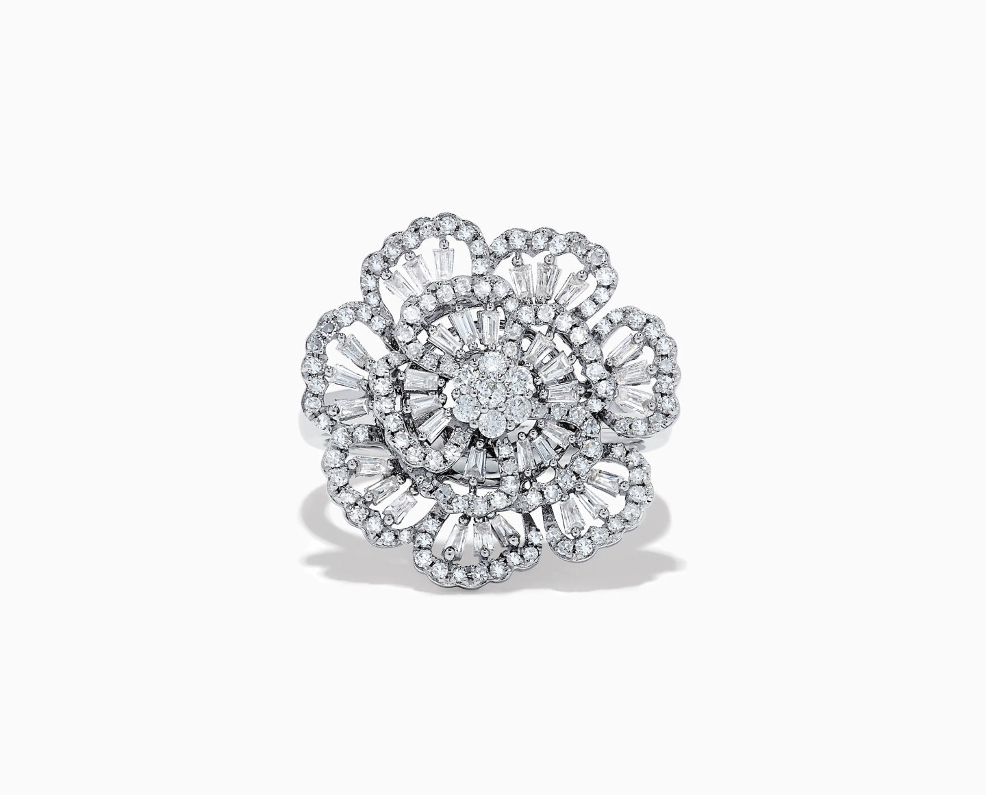 A diamond ring designed in the shape of a blooming flower, featuring multiple layers of sparkling diamonds set in white metal, with intricate petal details and a round center cluster.